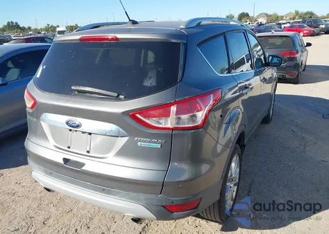 2014 Ford Escape Titanium z USA, uszkodzony, nr VIN 1FMCU0J99EUB62087